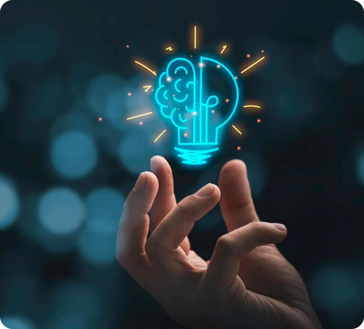 Brain and lightbulb hologram above hand