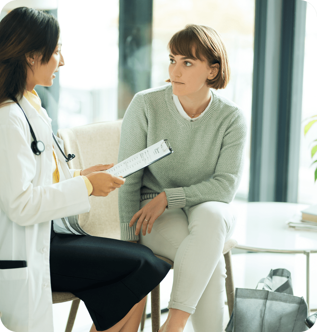 Medical professional discussing with a woman